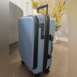 New! CALPAK 22” Hardside Carry-on Spinner With Front Pocket in Amalfi Blu